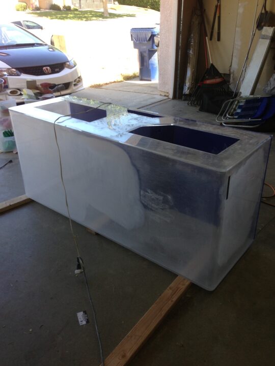 Before: a rectangular acrylic tank with a dull, clouded surface.