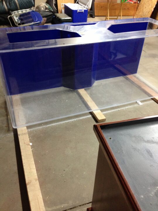 After: the same tank with clear panels over its blue back panels.
