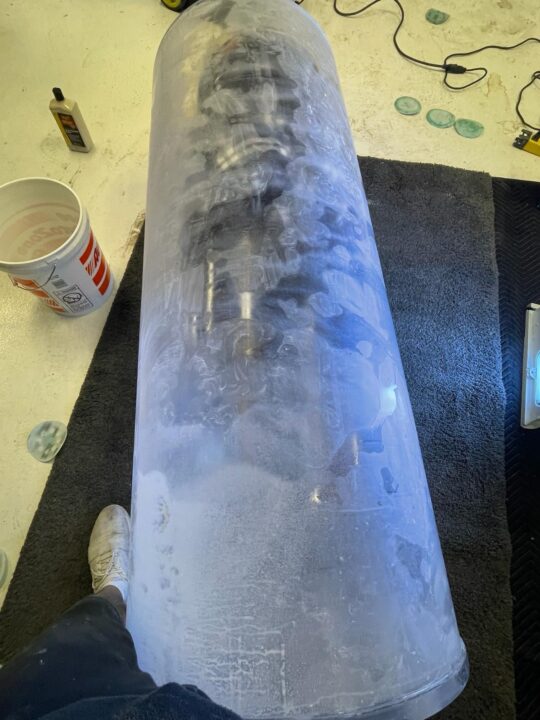 Before: an acrylic cylinder with a heavily scuffed surface.