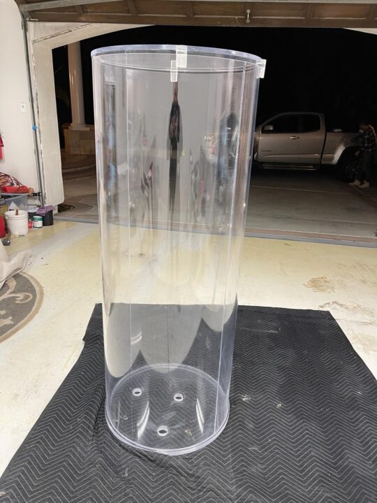 After: the same acrylic cylinder, polished clear.